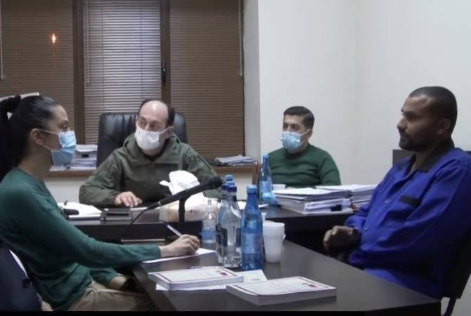 One of the two Turkish Syrian mercenaries (on right) being held in Armenia during an interrogation in Nov. 2020. Official photo